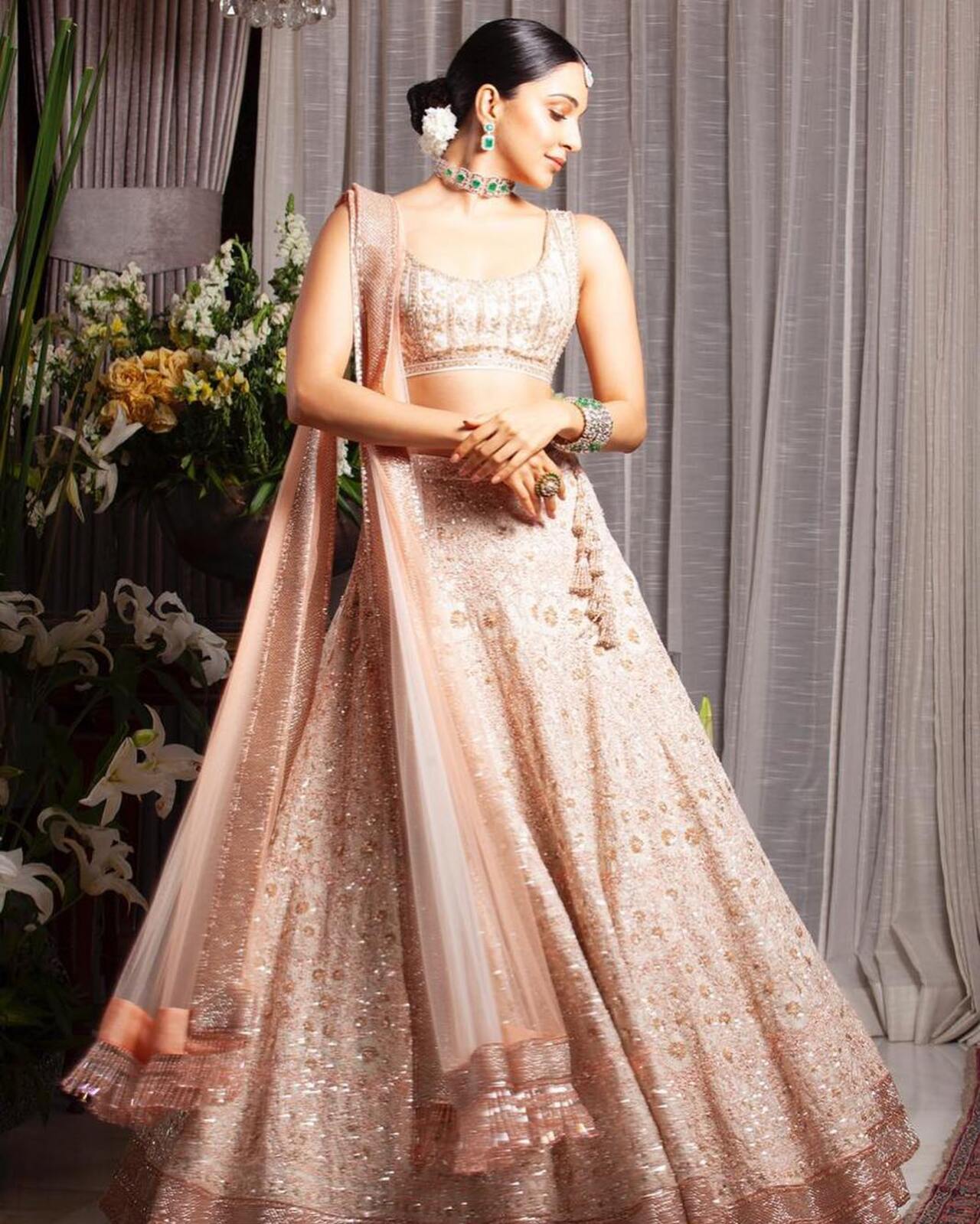 Kiara's blush pink lehenga is fit for a bride-to-be (or her best friends)! This beautiful chikankari lehenga with its light and breezy fit is the perfect ensemble for a summer wedding