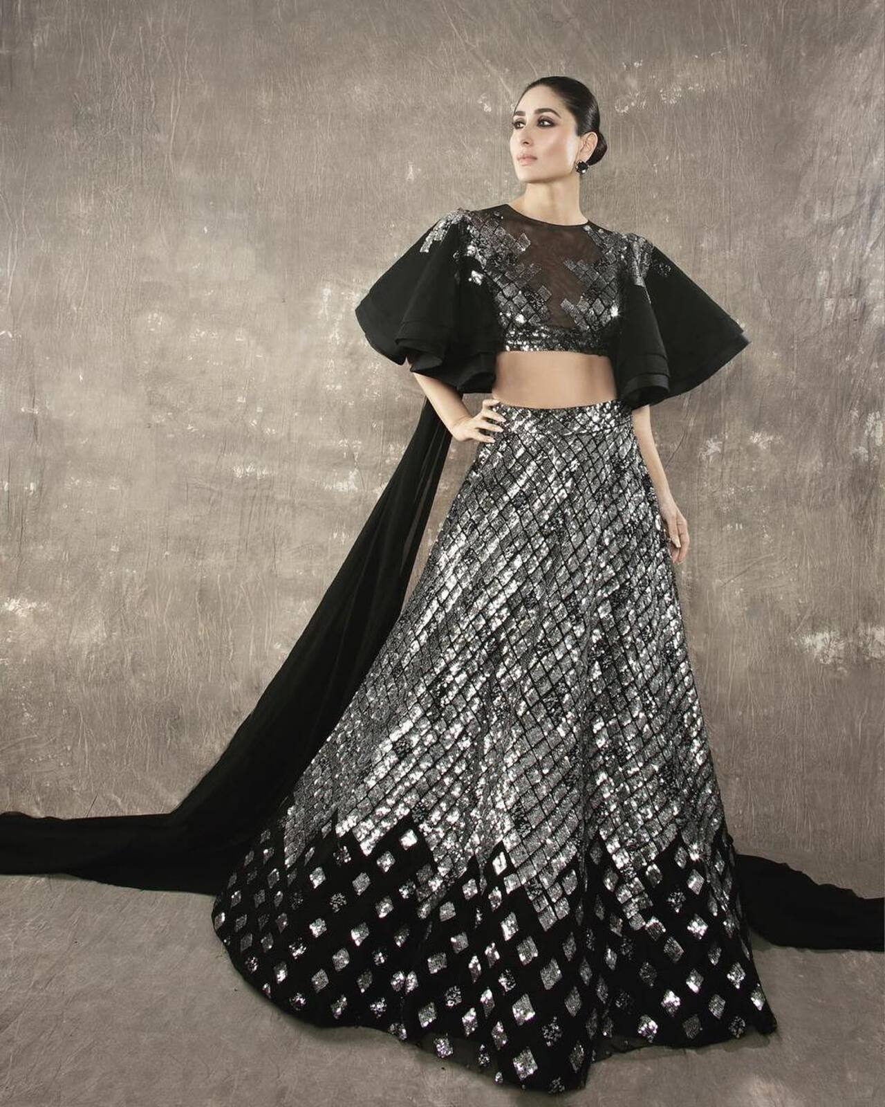 Kareena Kapoor
Kareena looked every bit the diva she is in this classy silver-black lehenga with high-necklined blouse. The silver-foil word, ruffled blouse and long train made this look even more eye-catching