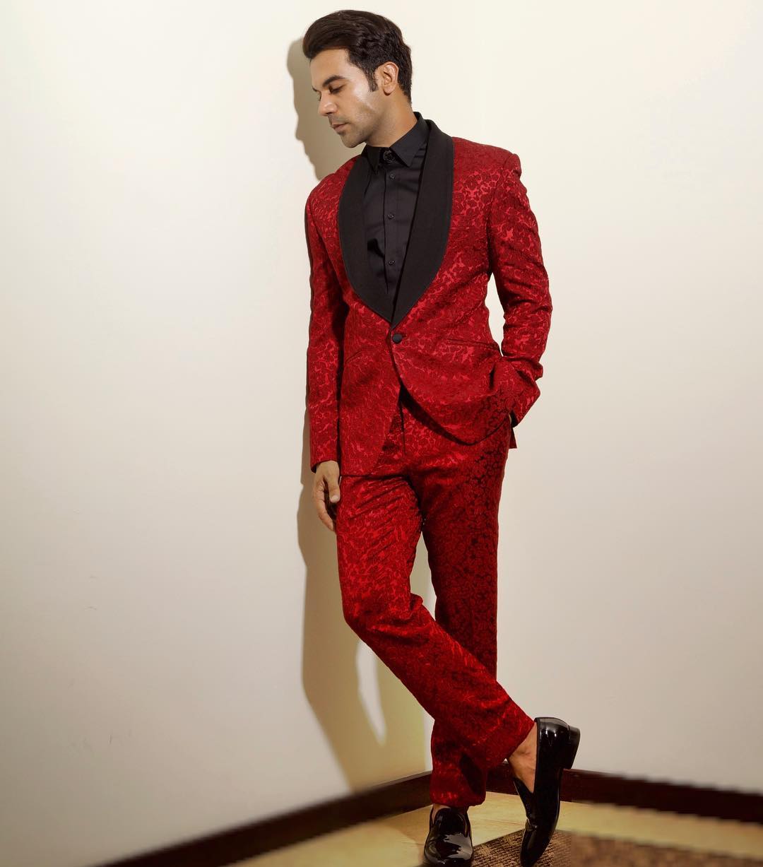 Rajkummar Rao looks super sharp in a vibrant red suit. The bold color adds a dash of fun to his outfit, showing off his confident and stylish side.