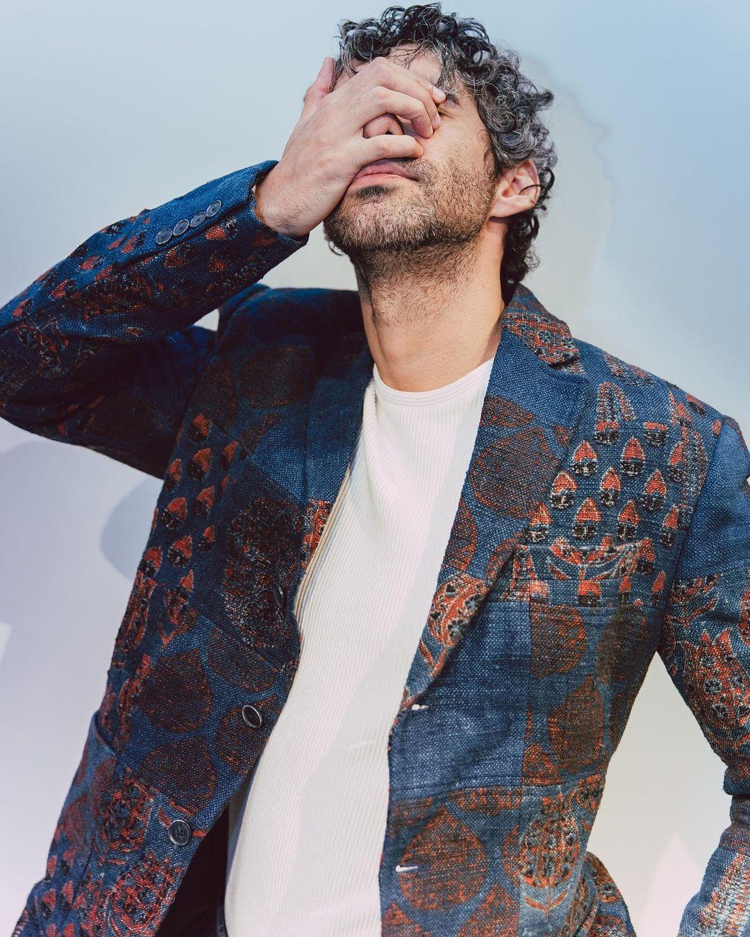 The patchwork design adds a unique dimension to the jacket, while the indigo color exudes a sense of elegance and sophistication.