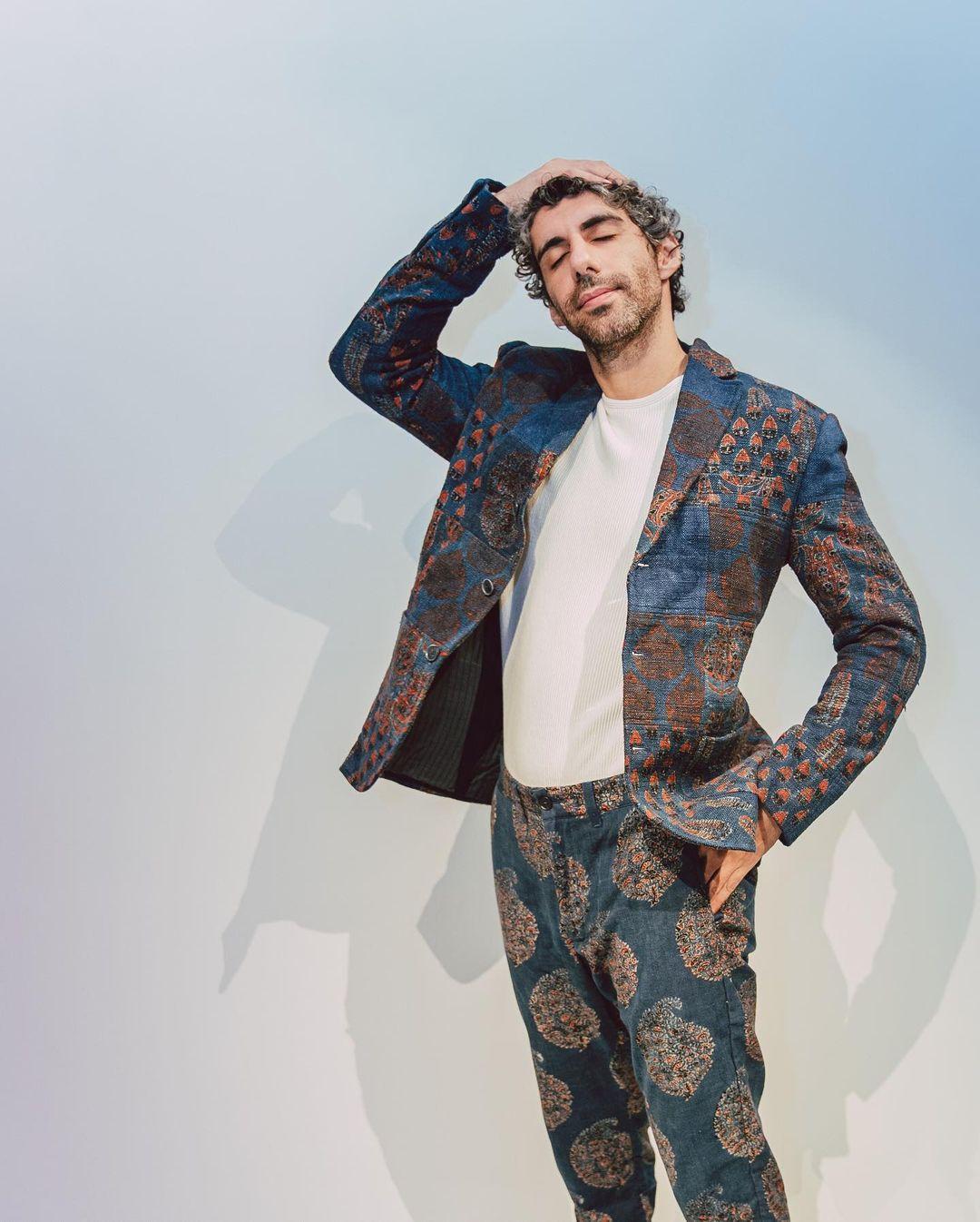 Continuing his fashionable streak, Jim Sarbh showcases another captivating ensemble from Good Earth's Menswear collection. He effortlessly dons a well-fitted patchwork jacket that boasts exquisite Ajrakh hand-block prints in a rich indigo hue. 