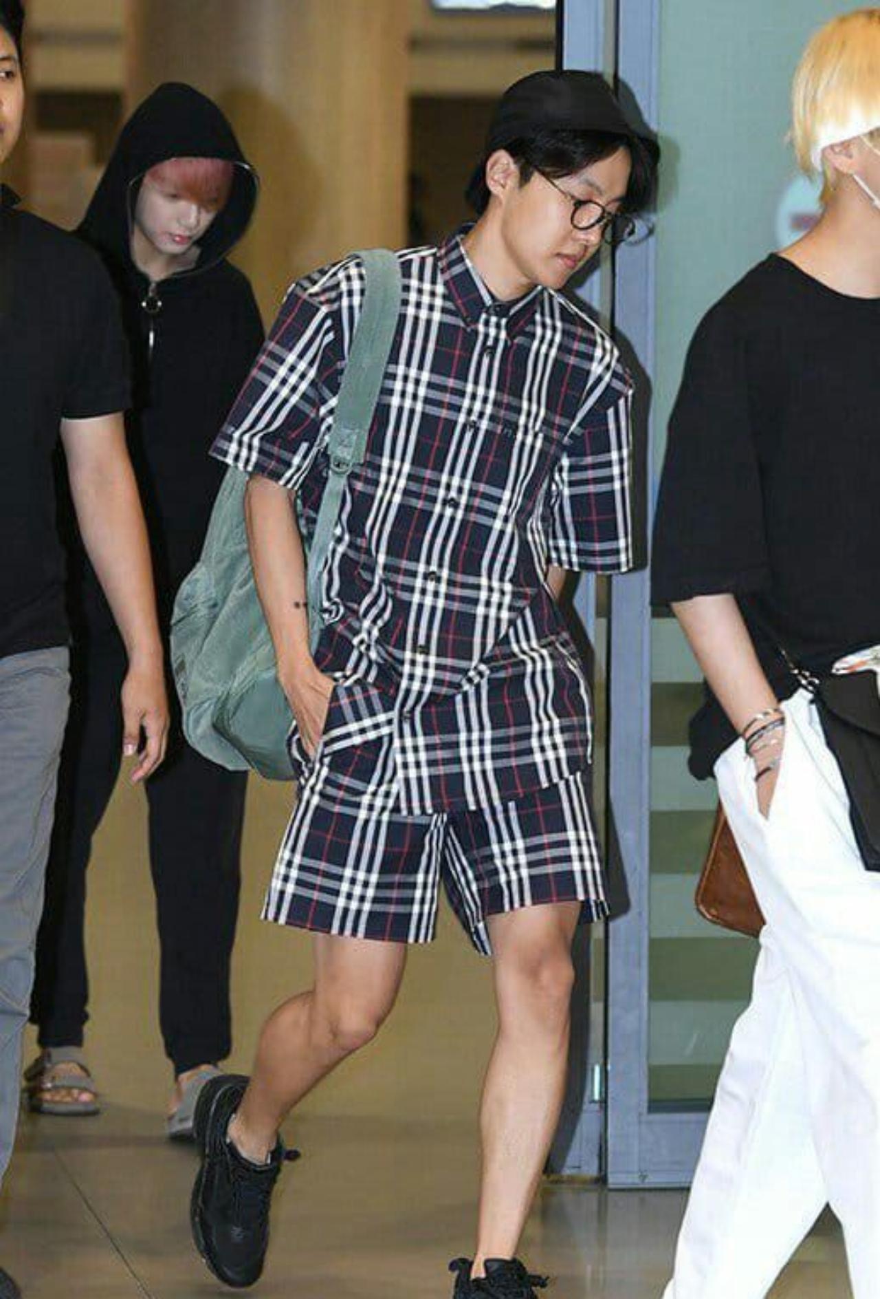 J-Hope is rocking this checkered co-ord set - an outfit he wore during BTS's vacation to Malta on their reality travel show - 'Bon Voyage.' Meanwhile, Jungkook in the background has put on his classic black hoodie and pants. Take a look at his style file here 