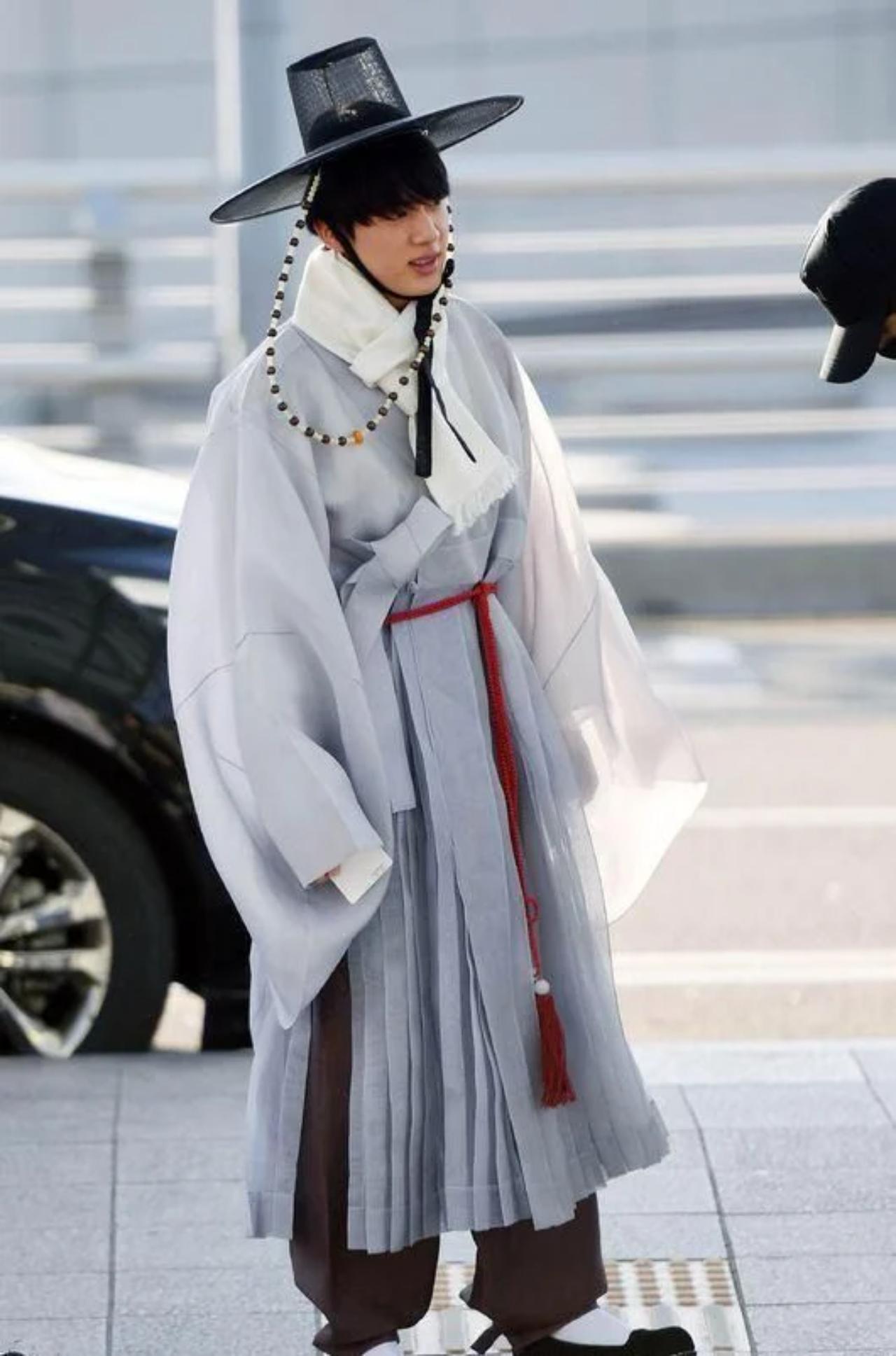 BTS also has a funny tradition of 'punishment' outfits. Losers of games on Run! BTS are subjected to punishments that often involve wearing the most hilarious outfits at airports or award shows. But somehow, Jin still pulls off this multi-layered hanbok with style!