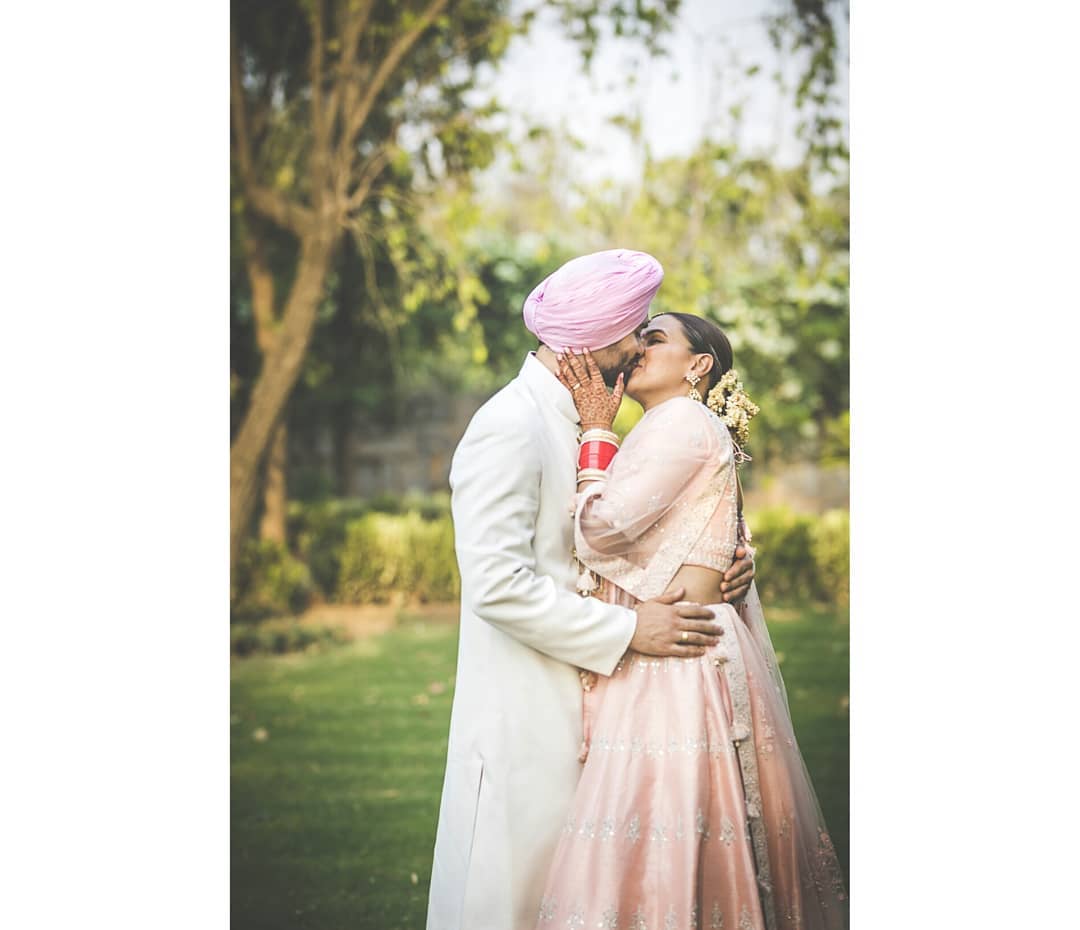 Neha's got this classic elegance going on – her smile is like the cherry on top of her bridal glow. And that blush pink lehenga? Totally on point. It's like the perfect blend of tradition and modern chic.
