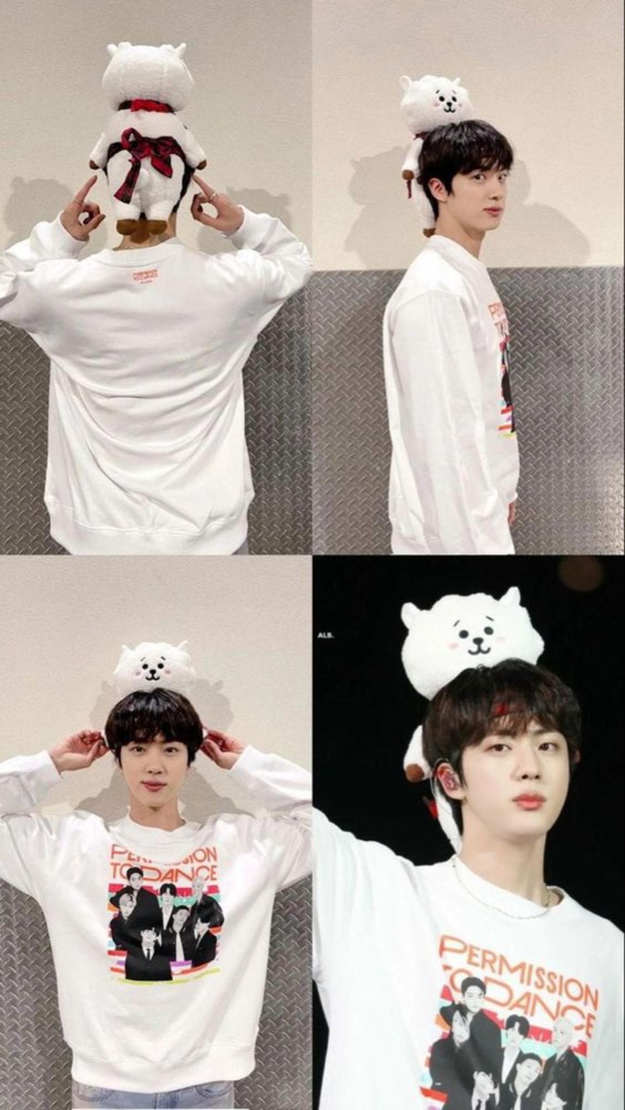 The saga of 'extra' concert ensembles continues! During BTS's Permission to Dance concerts in 2021, Jin surprised ARMY each day by serving up an extra dose of 'aegyo' (cuteness). Here, Jin strapped on a plushie of his self-designed BT21 character, RJ to his head