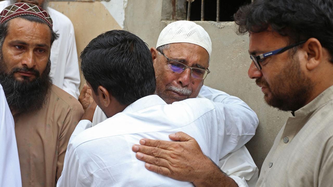 In Photos: Pakistan mourns deaths of 28 in train accident