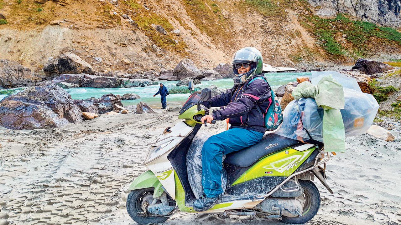 The scooterist traversed cold desert landscapes as well as scenic but harsh routes, including Zoji La Pass and Pangong Lake, which are notorious for sharp bends and cold weather conditions. She also rode through Chang La, Tanglang La, Lachung La, Nakee La, and Baralacha La. The scooterist at Drass in Kargil district in Ladakh (in picture).