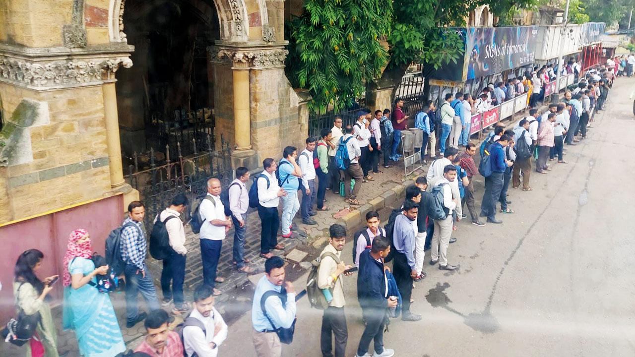 A long queue of commuters at CSMT waiting for BEST buses