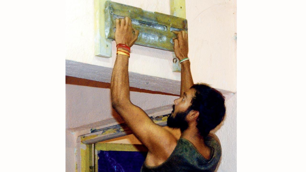 Climber Ratan Singh does finger push-ups at the training centre. Rock climbing requires every muscle in the body to be at its fittest for optimum performance
