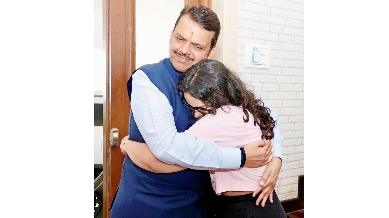 Deputy CM Devendra daughter Divija hugs Fadnavis upon his arrival in the city from Japan