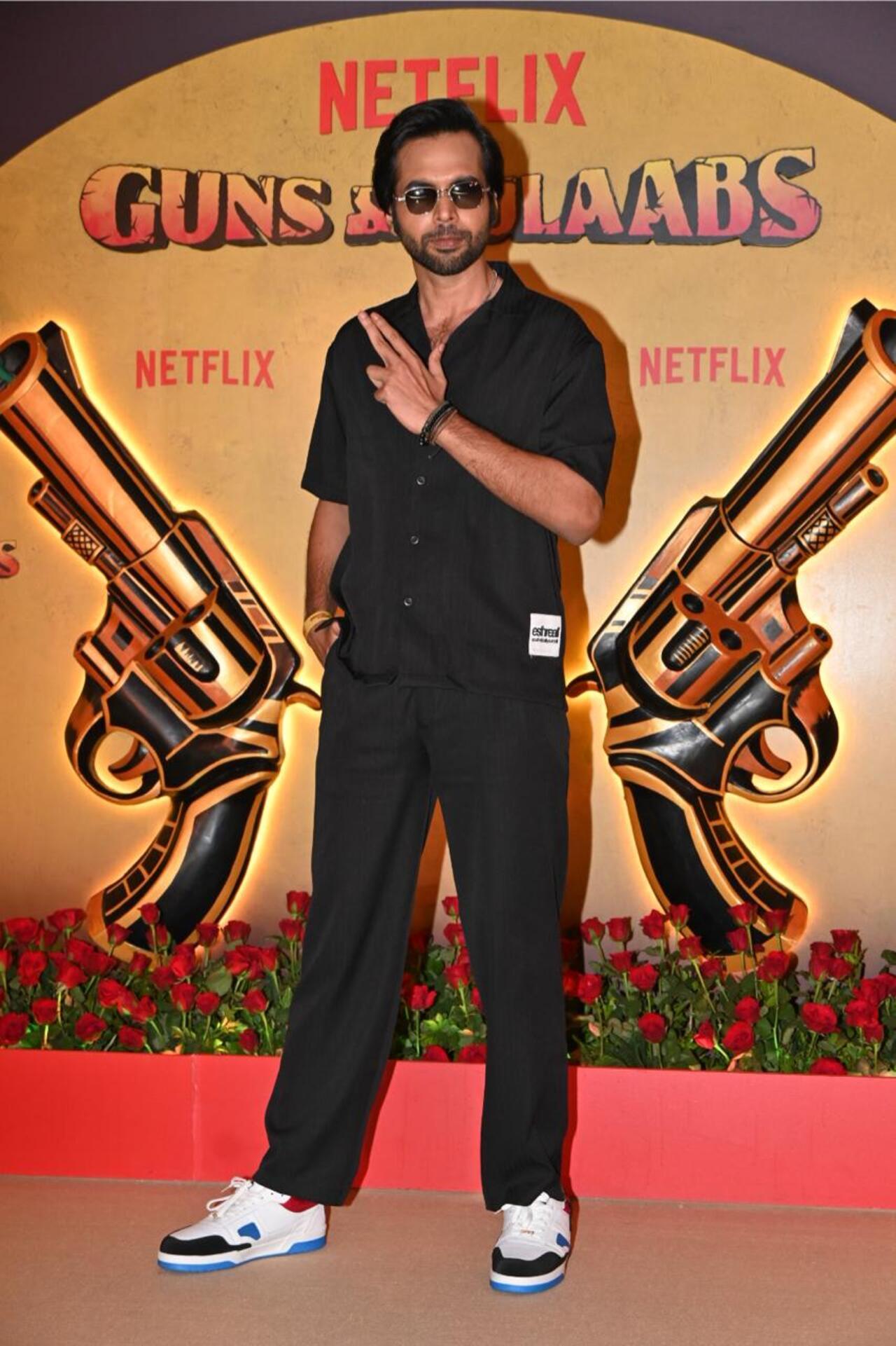 Abhishek Banerjee does a gun pose on the red carpet