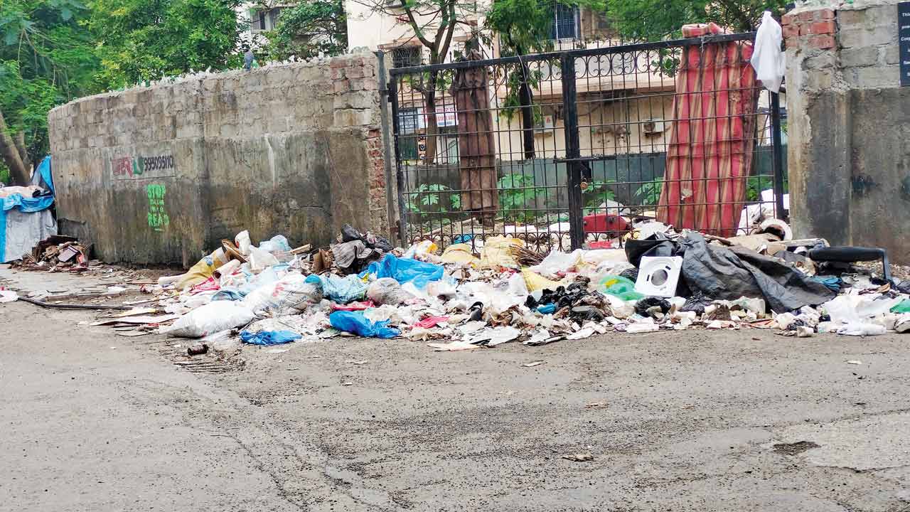 mid-day found that people dumped several items at JP Road, Seven Bungalows, which include household waste, even beds, construction material, etc. Pic/Ranjeet Jadhav