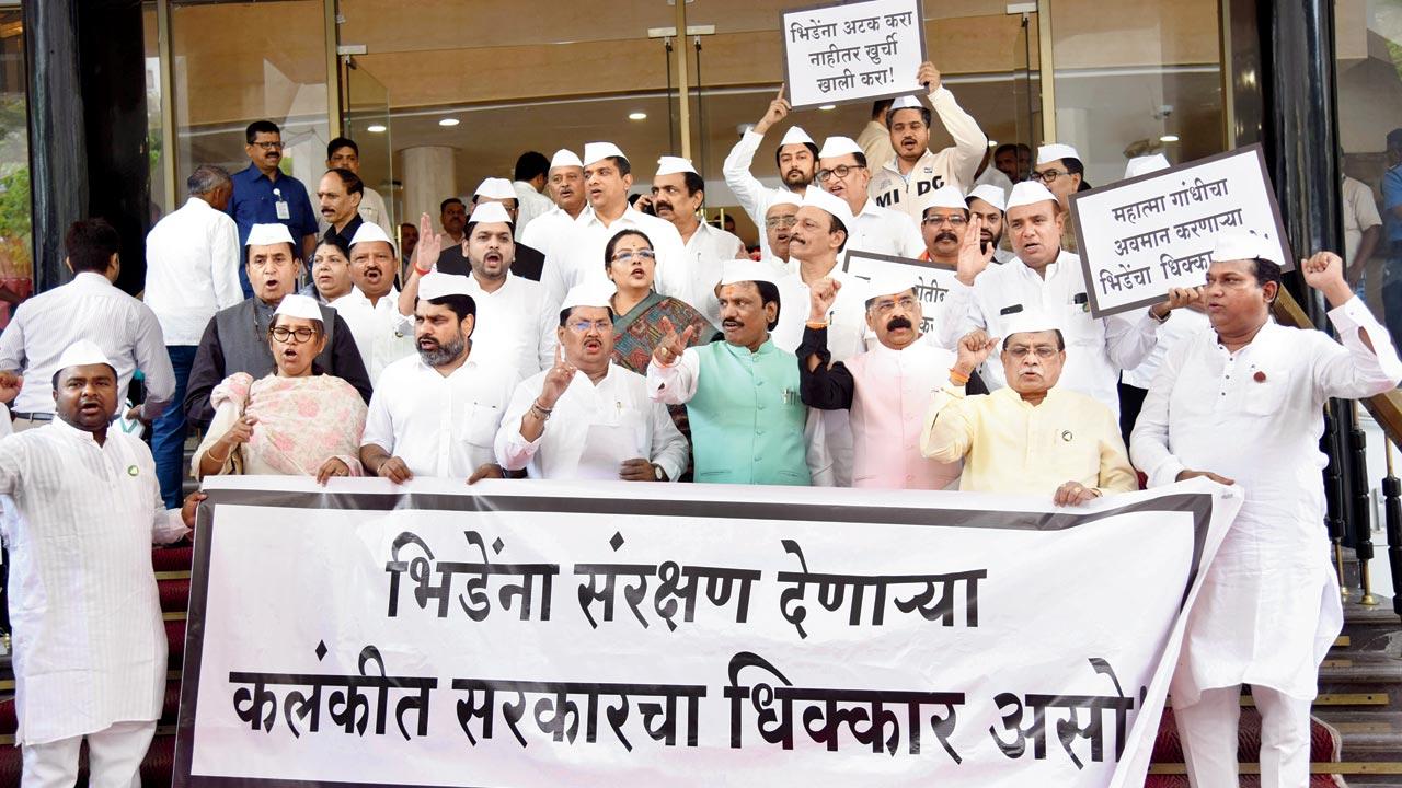 MLA Abu Azmi of the Samajwadi Party and others protest the firing on the Jaipur-Mumbai Express while criticising the government that continues to protect Sambhaji Bhide, on the steps of Vidhan Bhavan on Wednesday. Pic/Ashish Raje