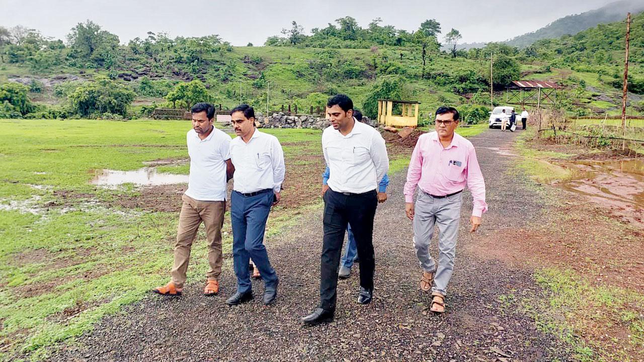 Satyajit Bade, additional CEO of zilla parishad, Raigad, and his team inspect the land