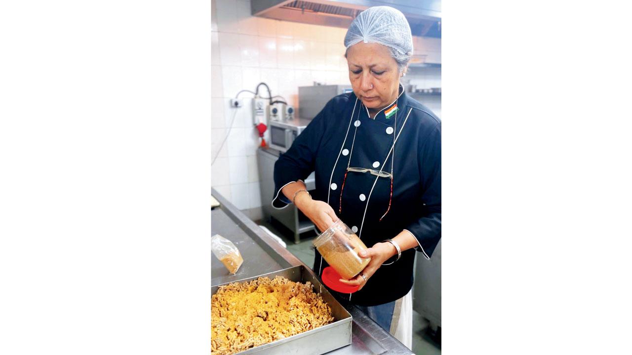 Chef Manzilat Fatima  picks out spices for a meal preparation