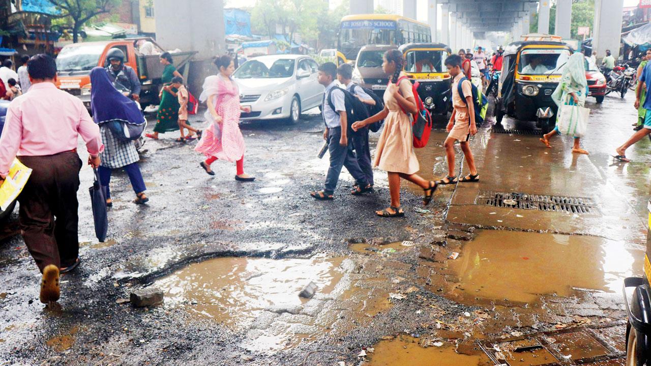 A potholed patch near Mith Chowky Metro station, Link Road, on July 26. Pic/Anurag Ahire