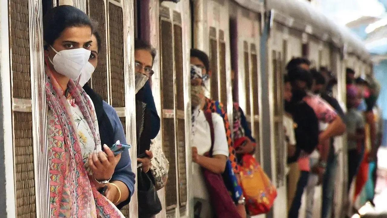 Observing line discipline while boarding the train during peak hours, taking care of wet raincoats before boarding the train, can go a long way in being mindful towards fellow travellers. Photo Courtesy: Mid-day file pic