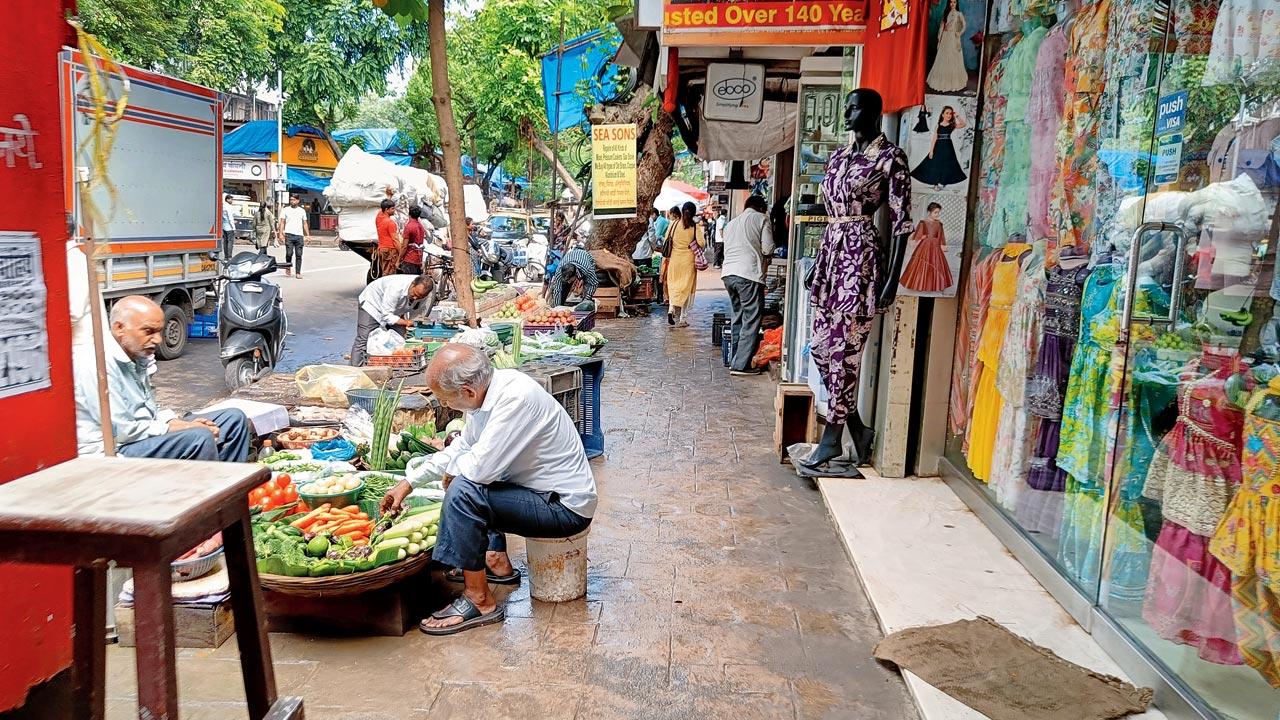 Hawkers and stores dominate this walkway on Ranade Road in Dadar