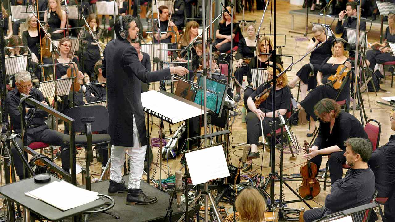 Ricky Kej conducts the orchestra. Pic courtesy/Sairam Sagiraju