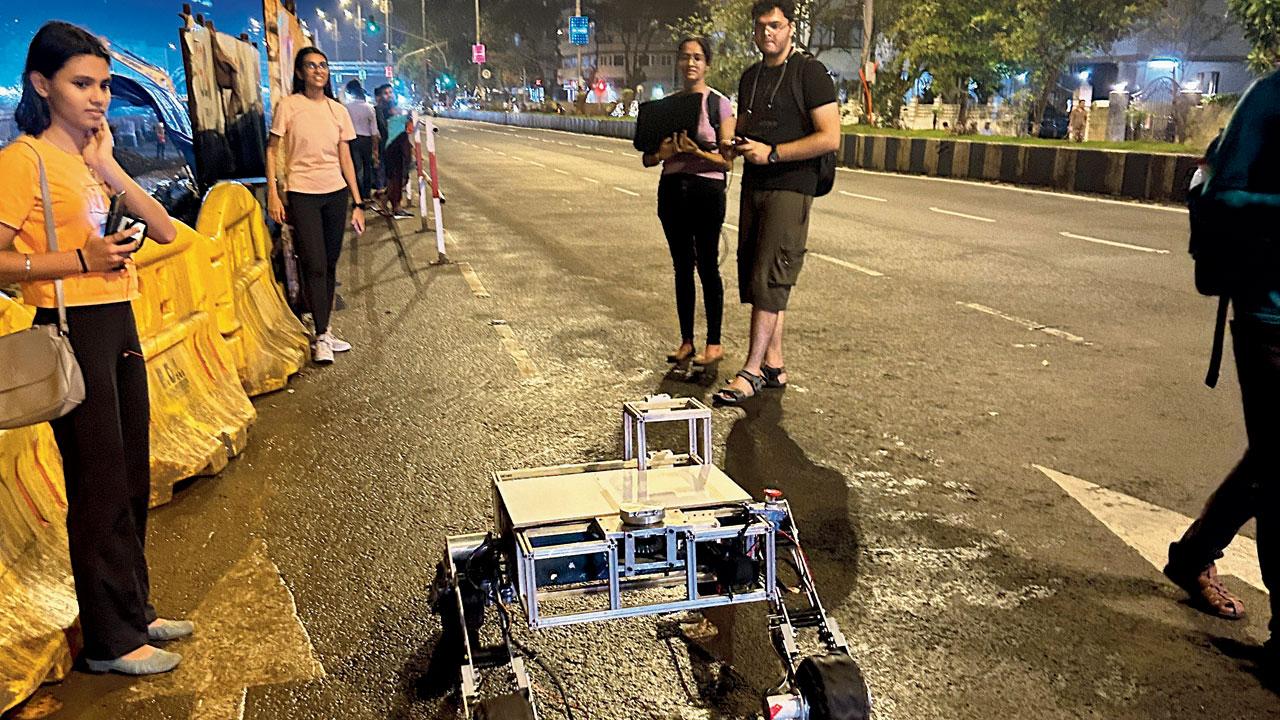 Students of DJ Sanghvi college with their rover, Abhyaan, on Marine Drive