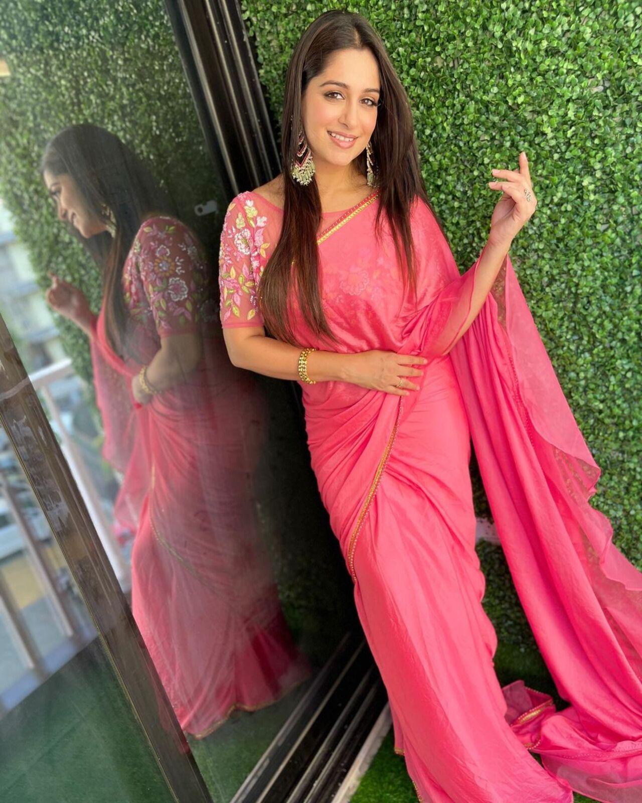 For this look, the actress opted for a plain pink saree paired with an embroidered matching blouse For this look, the actress opted for a plain pink saree paired with an embroidered matching blouse
