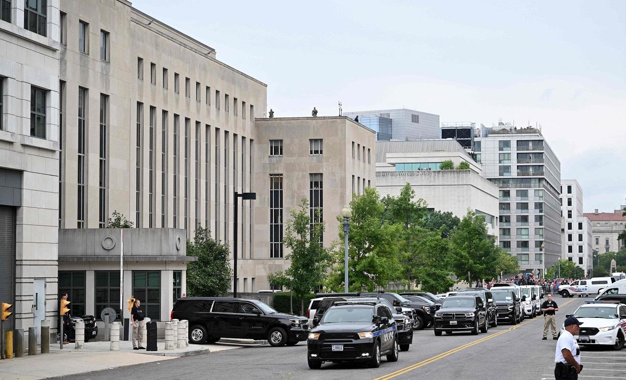 Wearing a dark blue suit and a red tie, Donald Trump, 77, arrived at the courthouse in a motorcade after he flew in from Bedminster in New Jersey