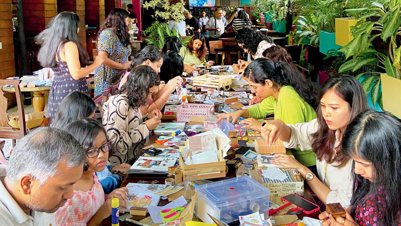 Participants craft their journals at a previous workshop