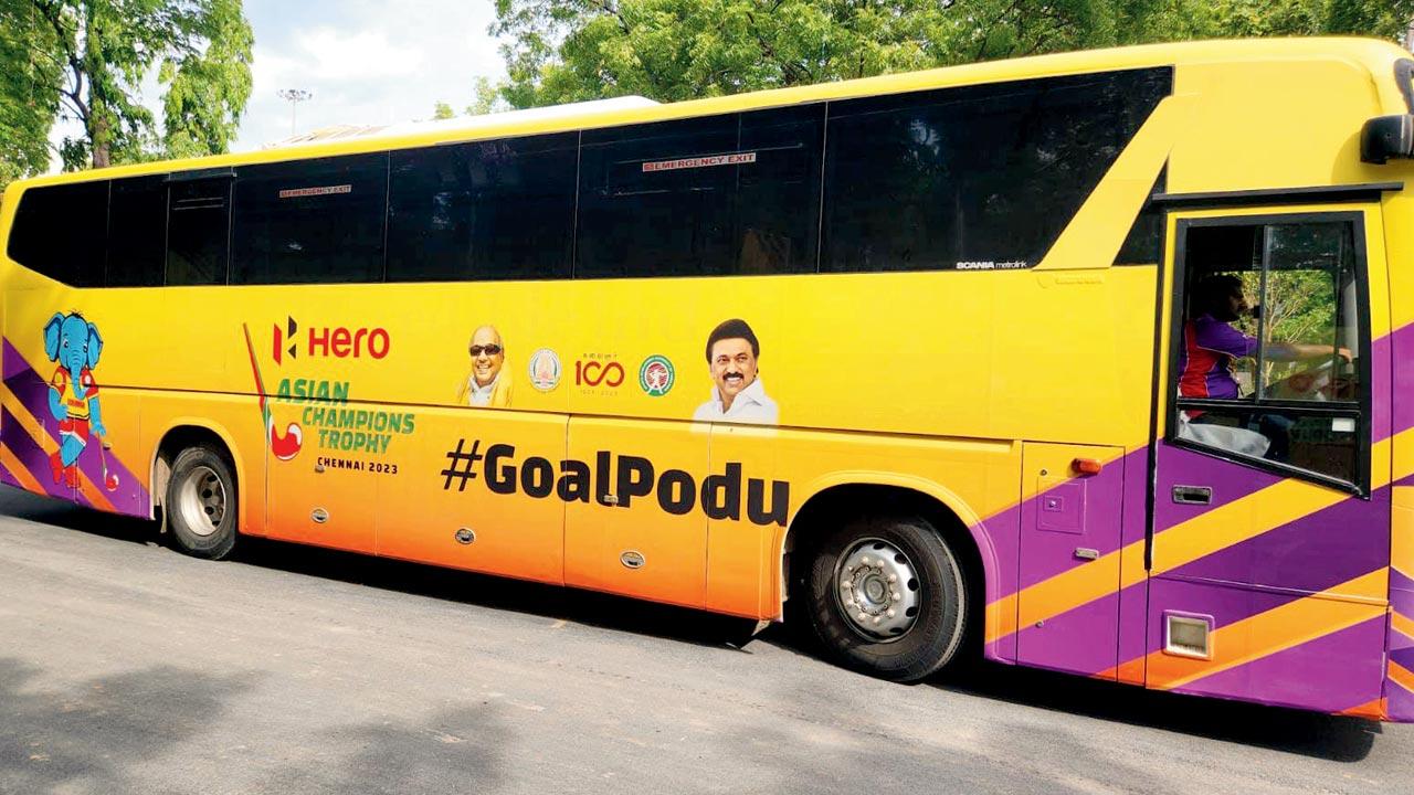 A team bus at the ACT 2023 with the Goal Podu message splashed across it