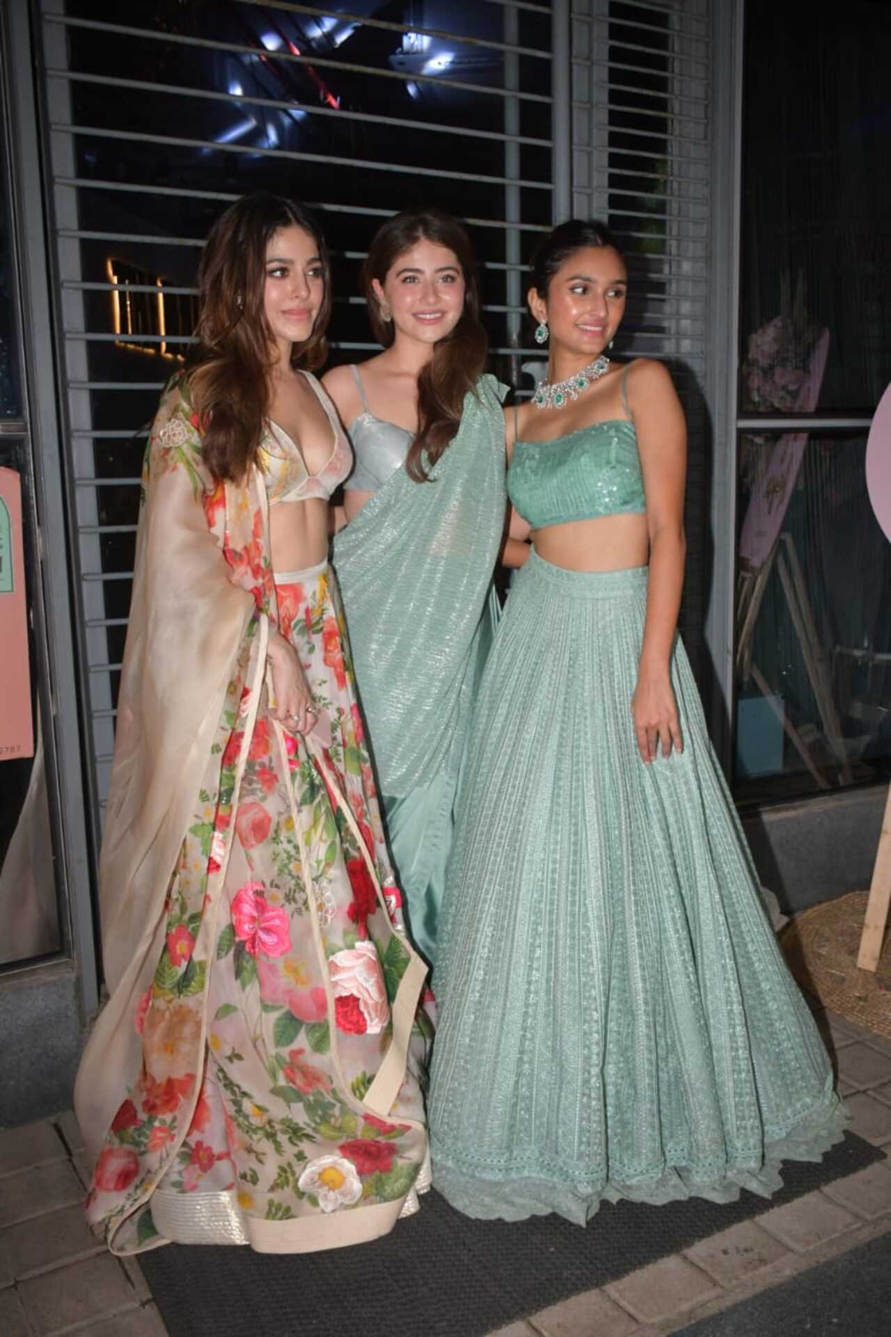 The pretty ladies strike a pose after the party