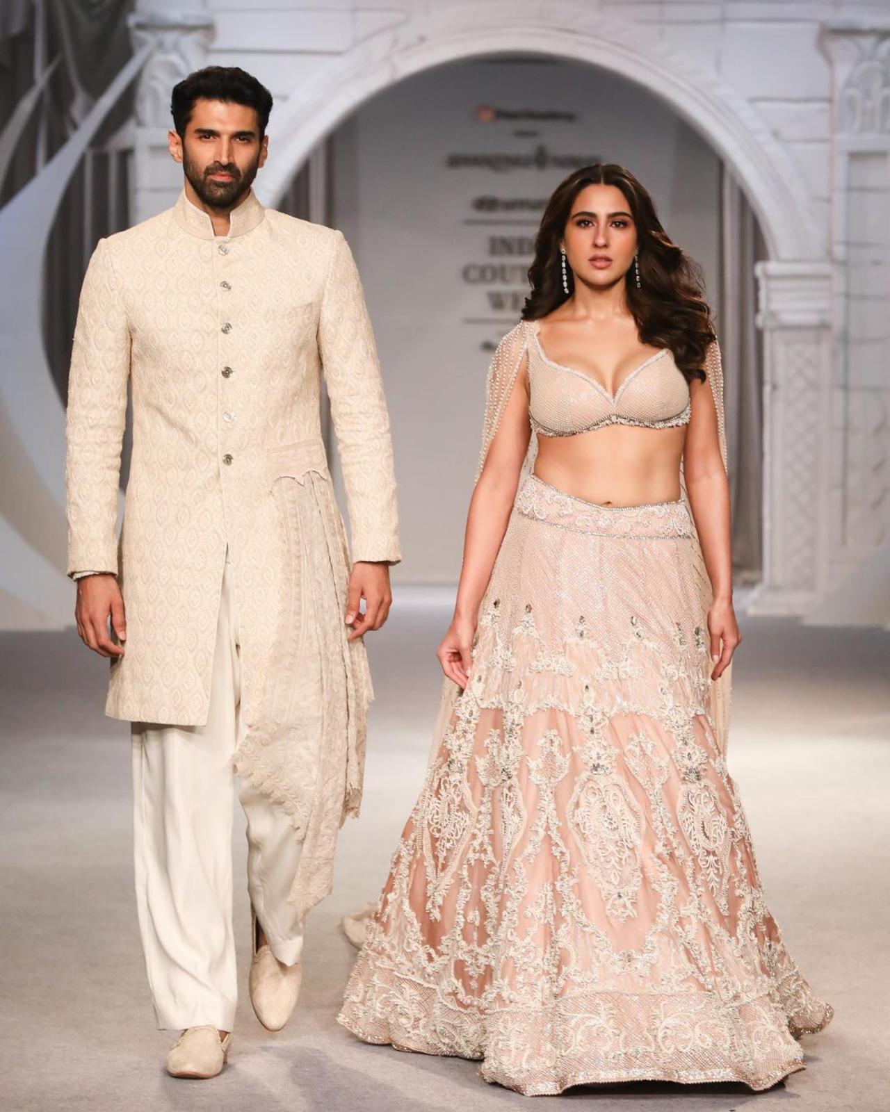 Aditya Roy Kapur and Sara Ali Khan turned showstoppers for the 'Etheria' collection. Sara dazzled audiences in her intricately embroidered cream-coloured lehenga. Aditya swept the stage in his uniquely asymmetrical royal bandhgala