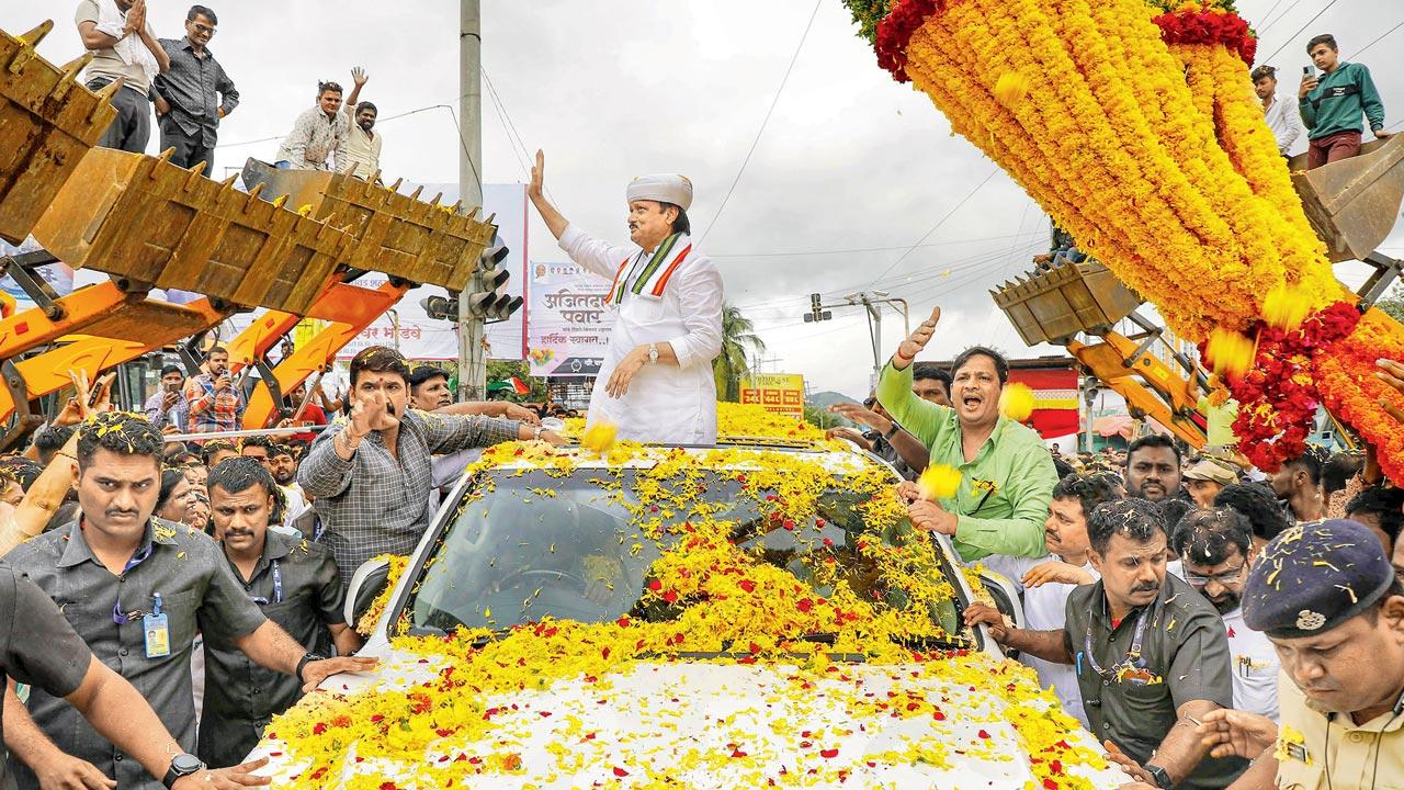 Deputy Chief Minister Ajit Pawar is welcomed in Pimpri-Chinchwad by supporters on Friday. PIC/PTI 