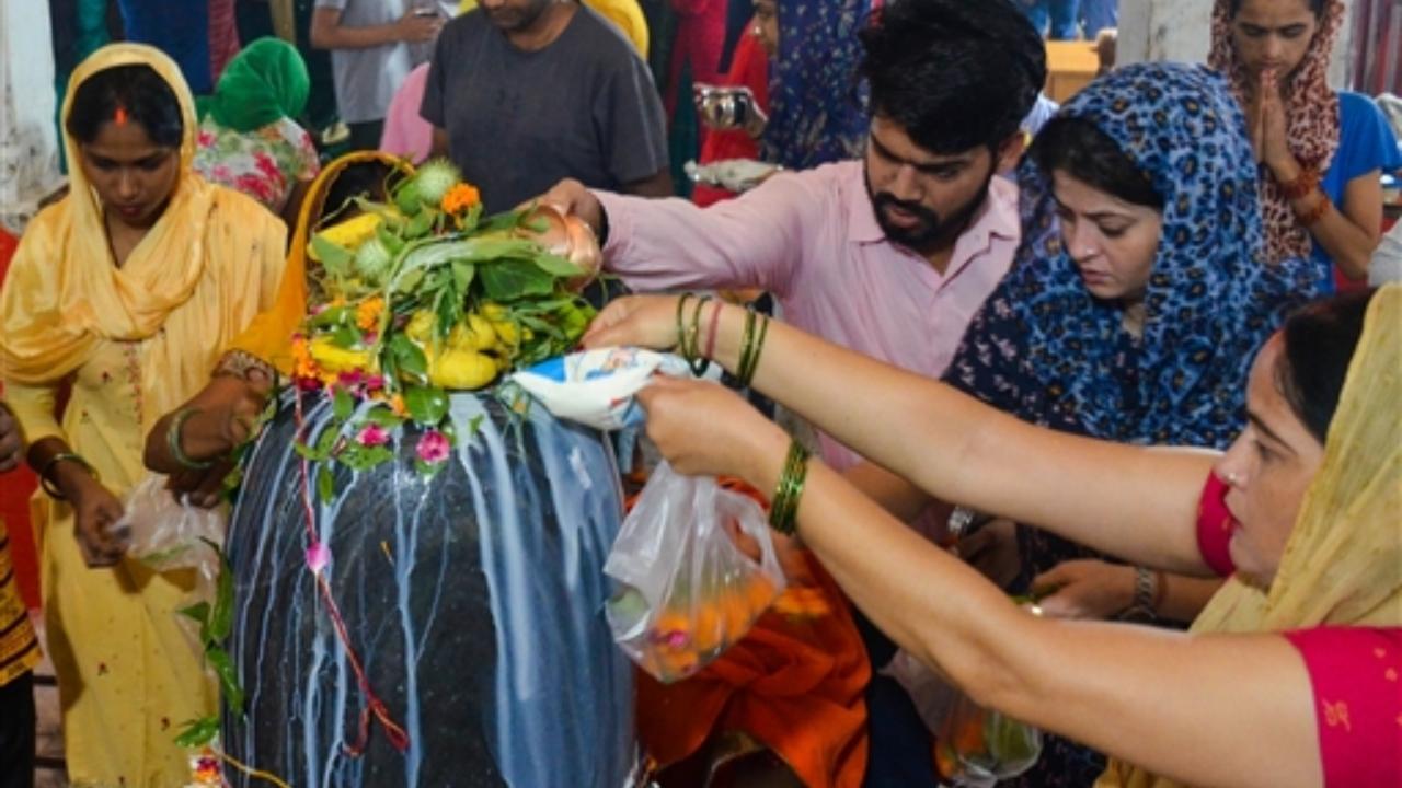 Devotees offer prayers at Lord Shiva temple on the occasion of 'Nag Panchami', in Gurugram