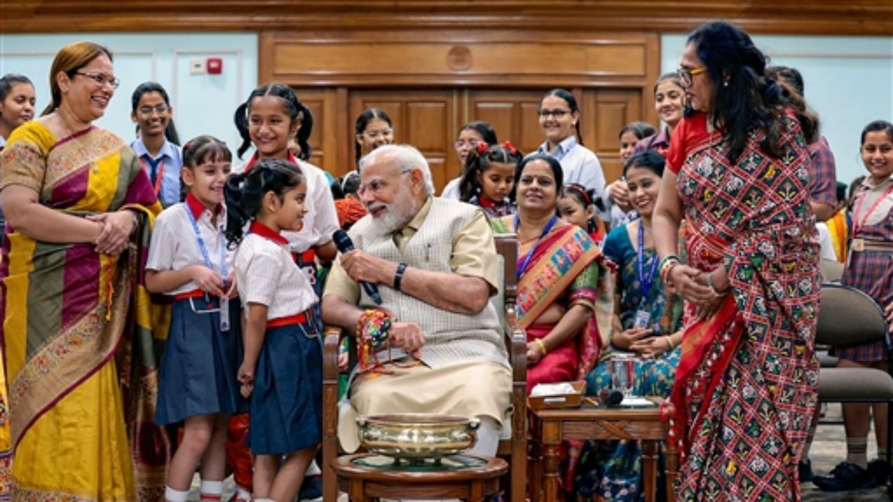 The school students tied rakhi on PM Modi's wrist and interacted with the him on various issues