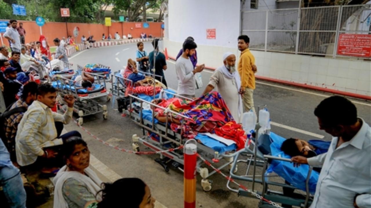 Patients being evacuated after a fire broke out in the endoscopy room on the second floor of the All India Institute of Medical Sciences
 