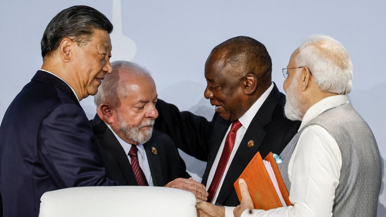 Prime Minister Narendra Modi and Chinese President Xi Jinping were on Thursday seen having brief exchanges ahead of a media briefing by the BRICS leaders in Johannesburg