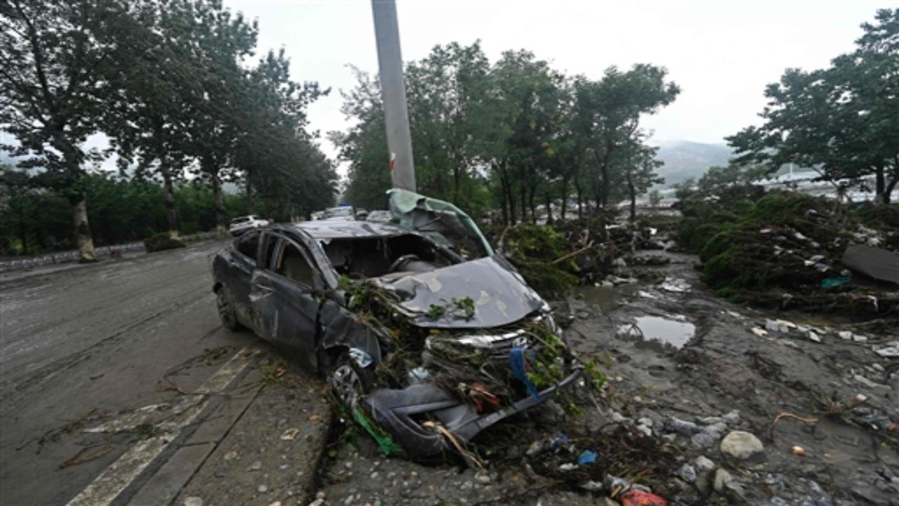 On Wednesday, waters in Gu'an county in Hebei, which borders Zhuozhou, reached as high as halfway up a pole where a surveillance camera was installed. Chinese authorities said Tuesday the torrential rains around Beijing had caused at least 20 deaths and 27 people are missing.