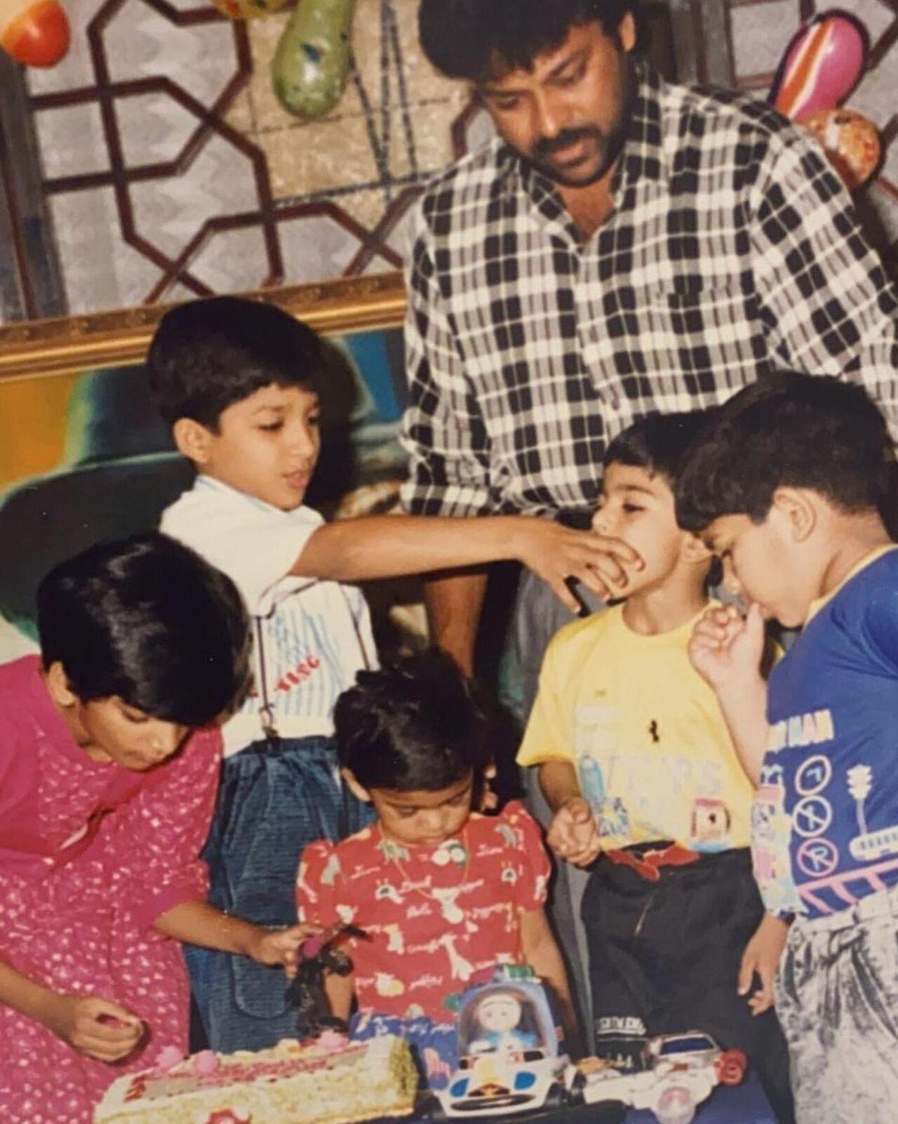 Allu Arjun feeds Ram Charan cake as Chiranjeevi looks on