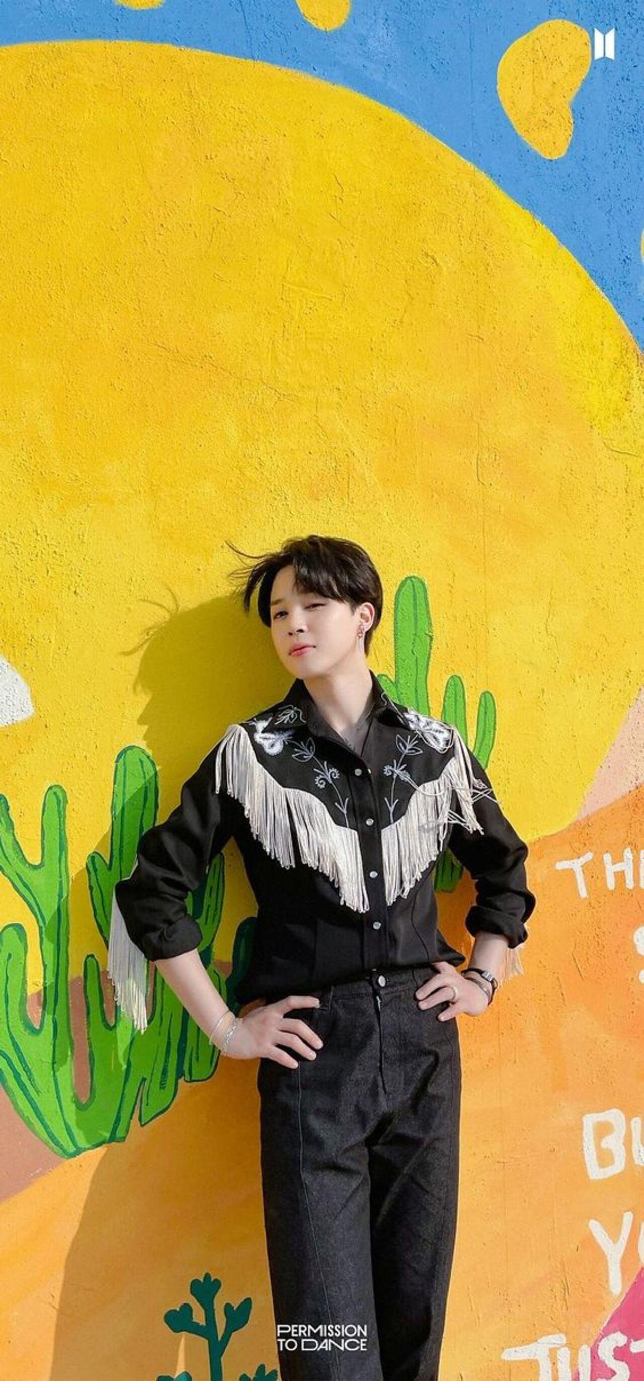 Does this outfit appear familiar to even you, non-ARMYs? Yes, that's right, this 'Permission to Dance' style was also borrowed by Ryan Kosling aka Ken for the Greta Gerwig hit movie, 'Barbie.' Jimin exudes the perfect summer-style energy with this all-black outfit with tassels