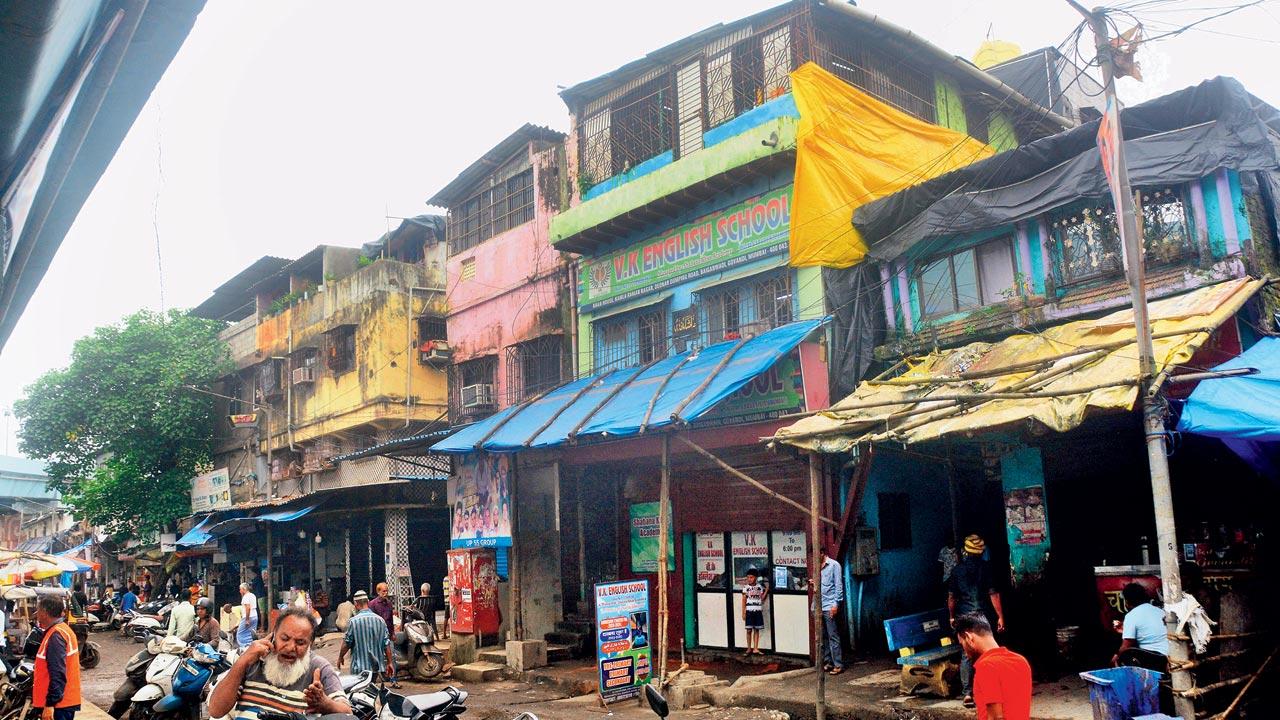 VK English School in the Bainganwadi slum of Govandi is surrounded by garages, hardware repair shops, shanties, and even a beedi shop