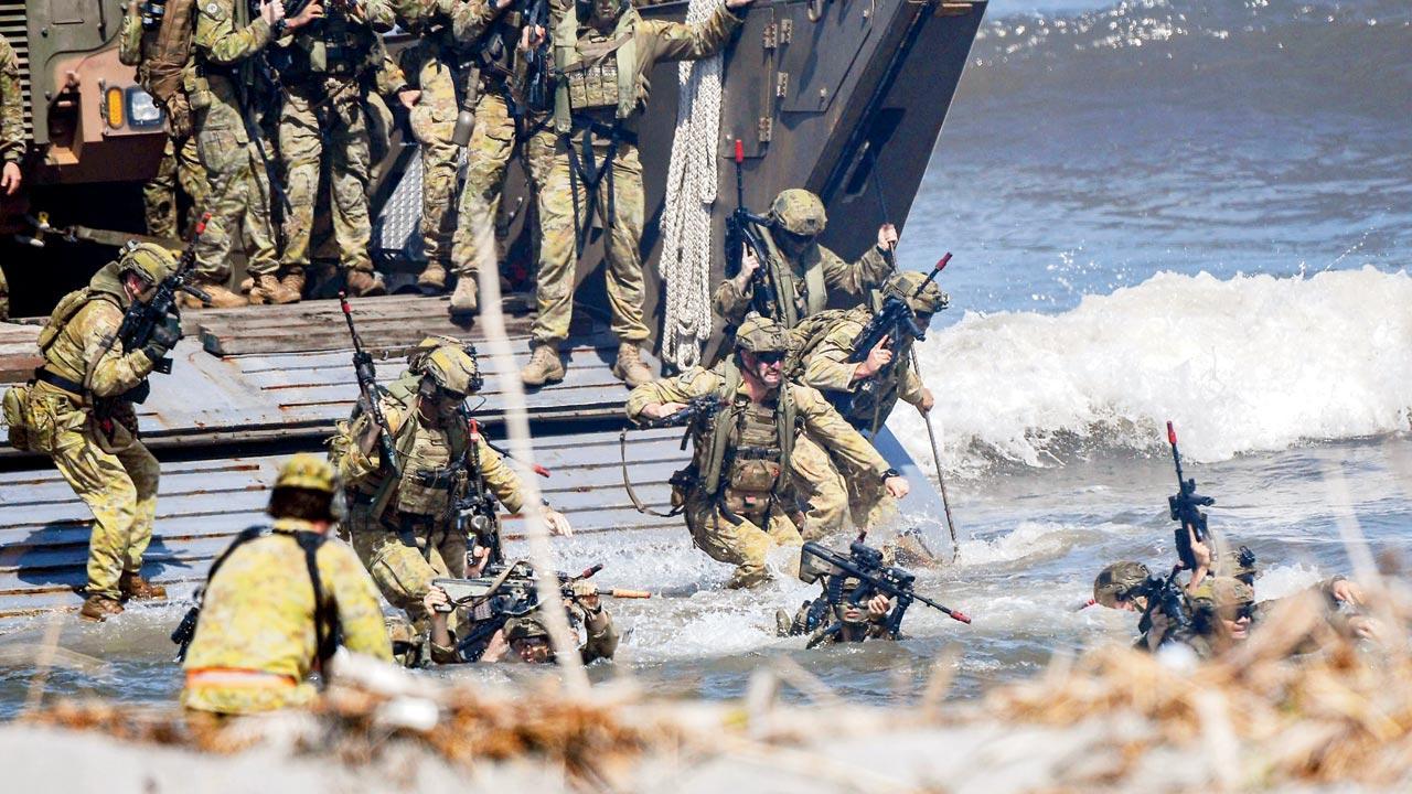 Aus, US, Filipino forces practice retaking South China Sea island