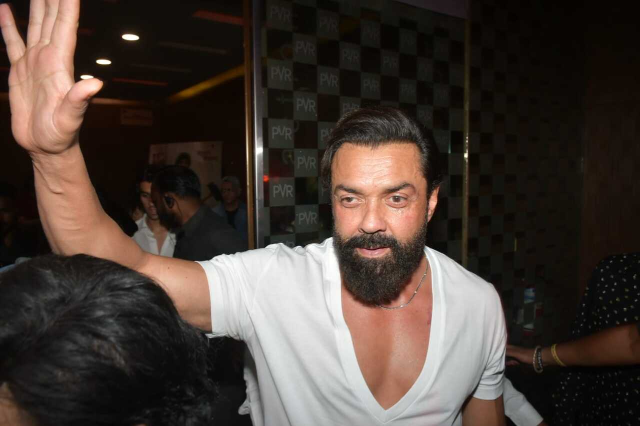 Bobby Deol waved to the paparazzi as he left the theatre post the screening