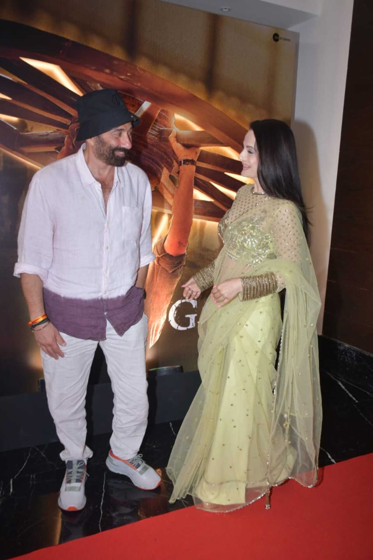 Sunny Deol opted for a simple shirt and pants for the party. Here is seen getting candid with his leading lady