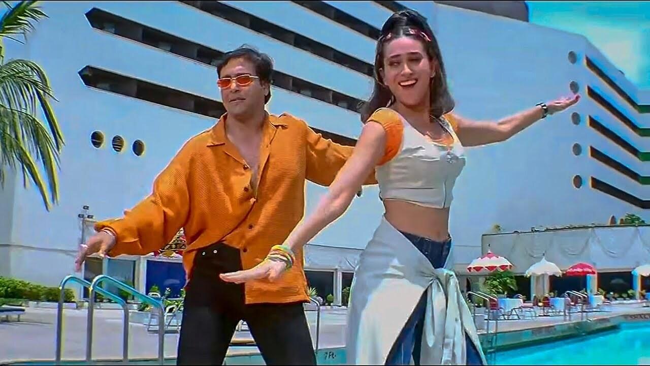 What Is Mobile Number is another popular song from the Sanjay Dutt and Govinda starrer 'Haseena Maan Jaayegi'. It is a fun song picturised on Govinda and Karisma Kapoor