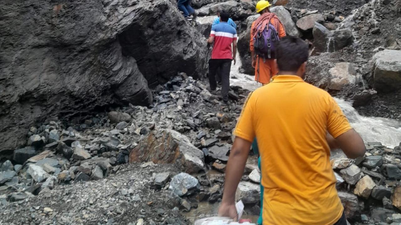 A team of the National Disaster Response Force (NDRF) travelled 15 km on foot to rescue the stranded people, including 15 children, and shift them to safe places, the officials said
