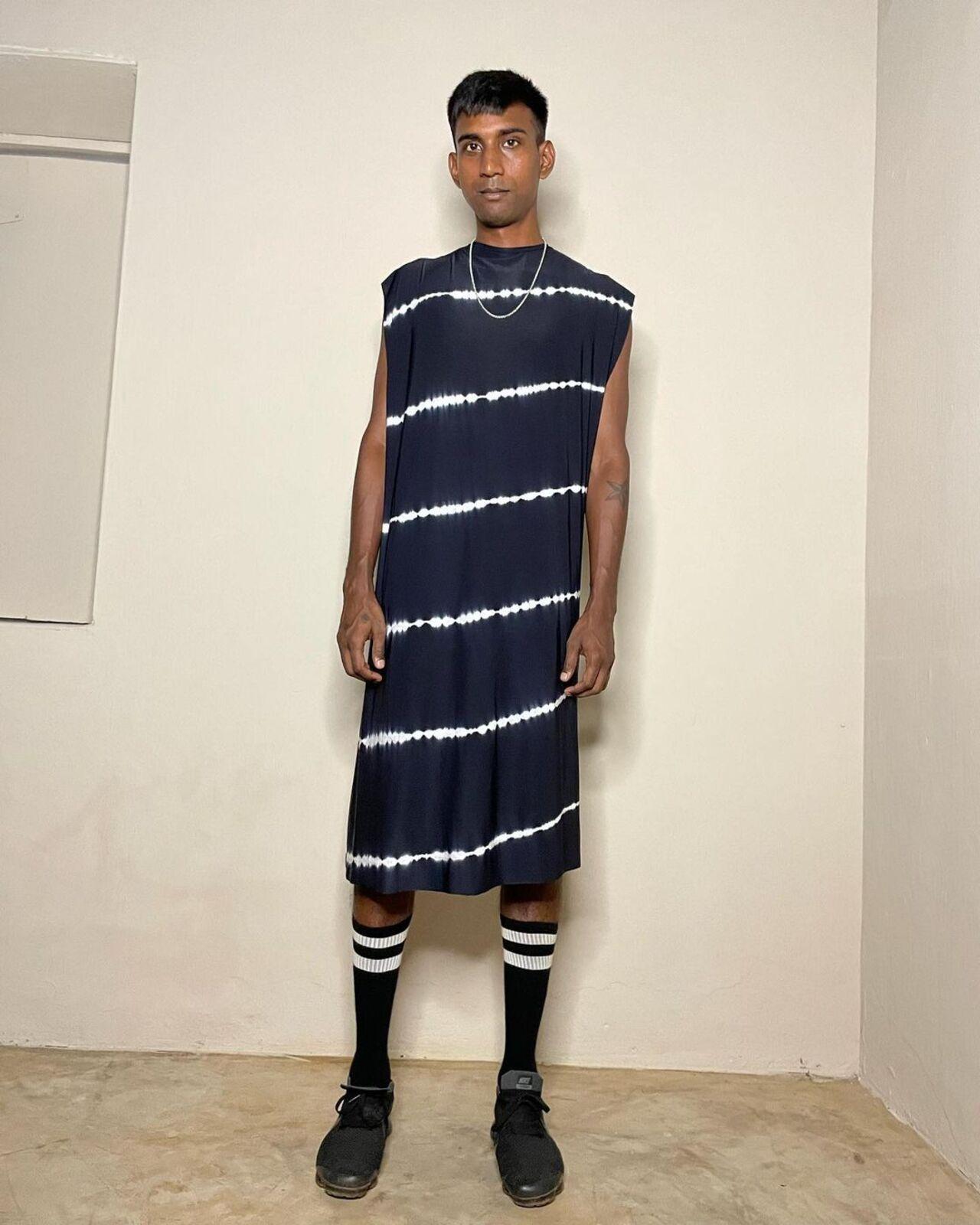Moral Science presents gender-neutral, workwear-inspired attire through its simplistic and functional designs. From handcrafted adornments to spirited apparel, the brand offers a comprehensive range. This straight-cut dress with pulled up socks perfectly captures its eclectic and playful appeal
