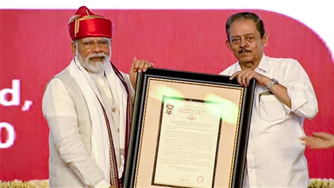 Prime Minister Narendra Modi being conferred with the Lokmanya Tilak National Award, in Pune, Tuesday, Aug. 1, 2023
