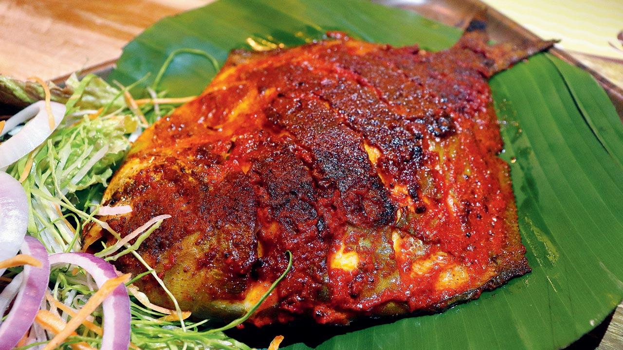 Suraj Shetty, partner at Mahesh Lunch Home, says that the tawa fry pomfret is the most sought-after dish at their restaurant. Pics/Anurag Ahire