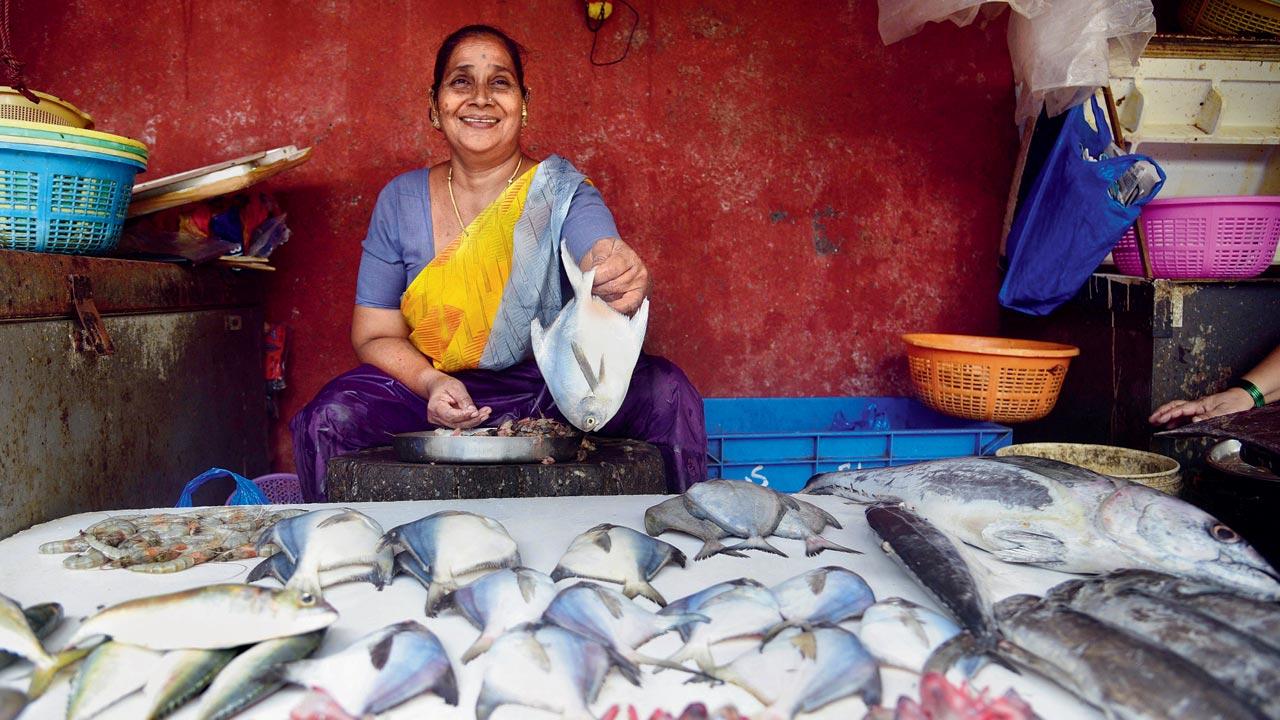Fishmonger Suvarna Tawde seen selling medium-sized pomfrets at the fish market in Pratiksha Nagar, Sion. Tawde says that while there’s a huge demand for super-sized paplet, they are hard to procure