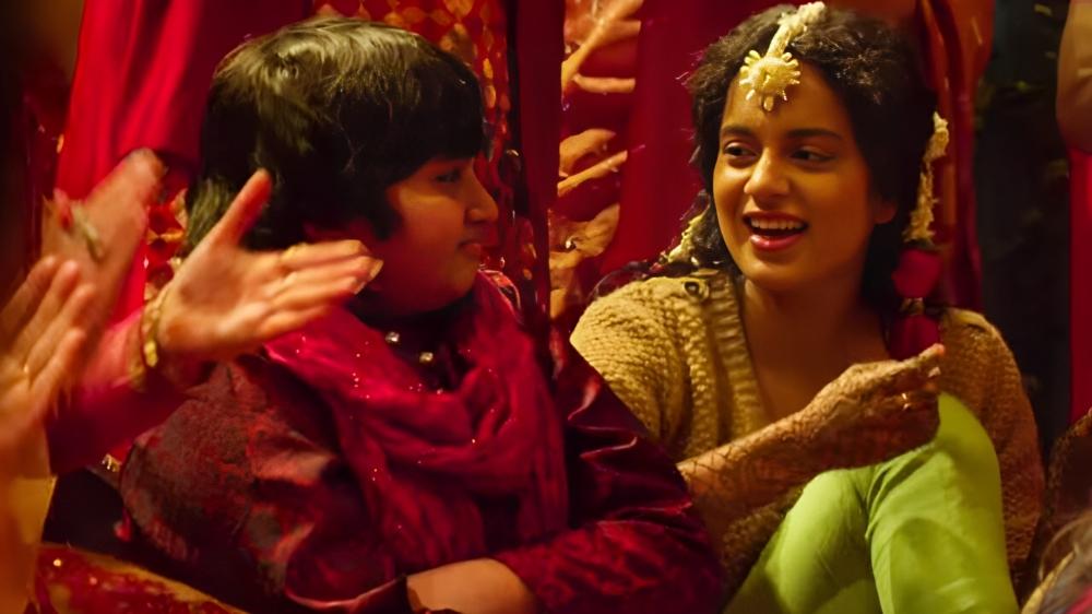 Queen takes us on a transformative journey with Rani (Kangana Ranaut) after her engagement is called off. Throughout the movie, her interactions with her younger brother, Chintu (Chinmay Chandraunshuh), offer moments of solace. 