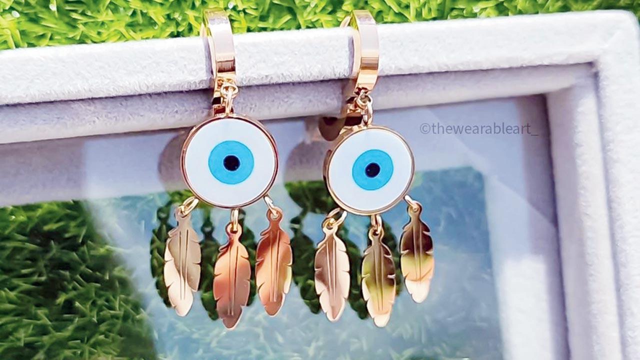 Accessorise your bondIf your sibling is one for aesthetics, gift them these delicate chains, bracelets, rings and earrings. Our favourites are the dream catcher evil eye earrings, their illustrated rakhis, and a pearl chain evil eye bracelet. Log on to @thewearableart_ (DM for express delivery).
